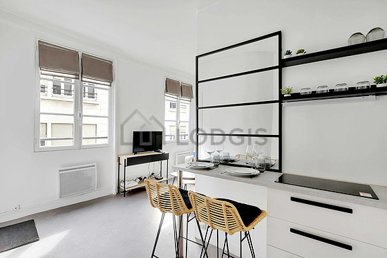 Kitchen equipped with hob, refrigerator