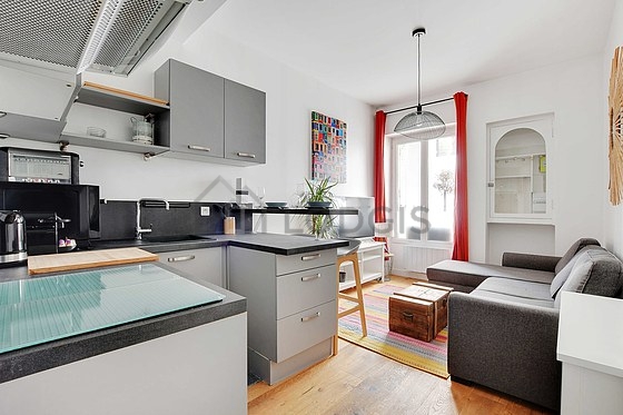 Kitchen equipped with hob, refrigerator