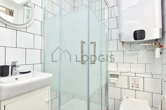 Bathroom equipped with washing machine, bath towels