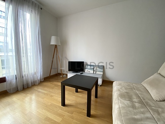 Living room with windows and balcony