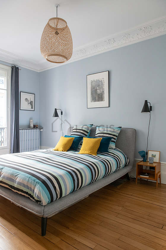 Chambre de 16m² avec du parquet au sol