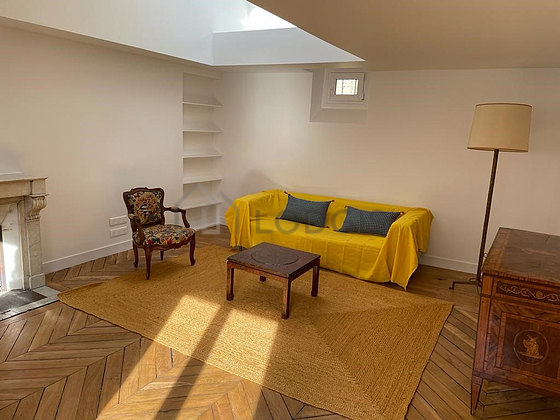 Very quiet living room furnished with sofa, coffee table