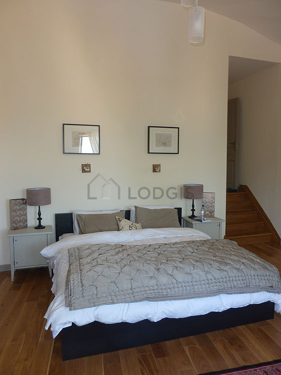 Bedroom with wooden floor