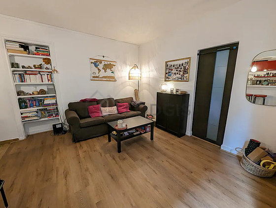 Very quiet living room furnished with sofa, coffee table, storage space