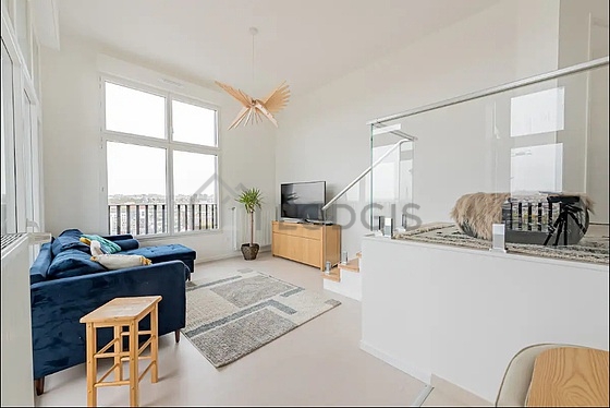 Very quiet living room furnished with air conditioning, tv, 1 chair(s)