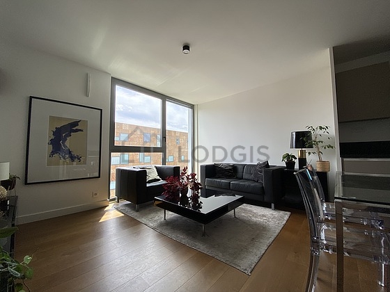 Living room with double-glazed windows facing the road