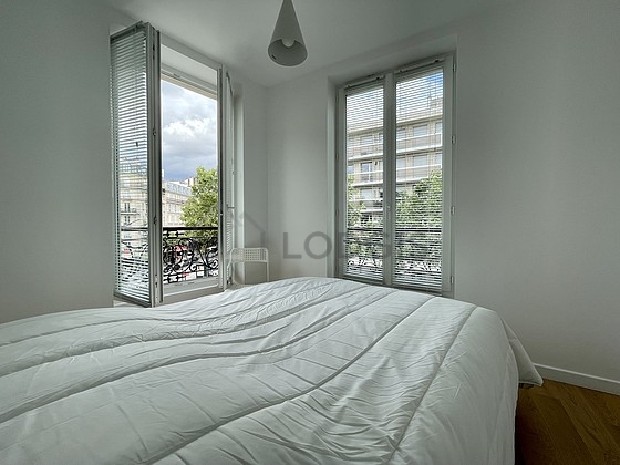 Bedroom with windows facing the road