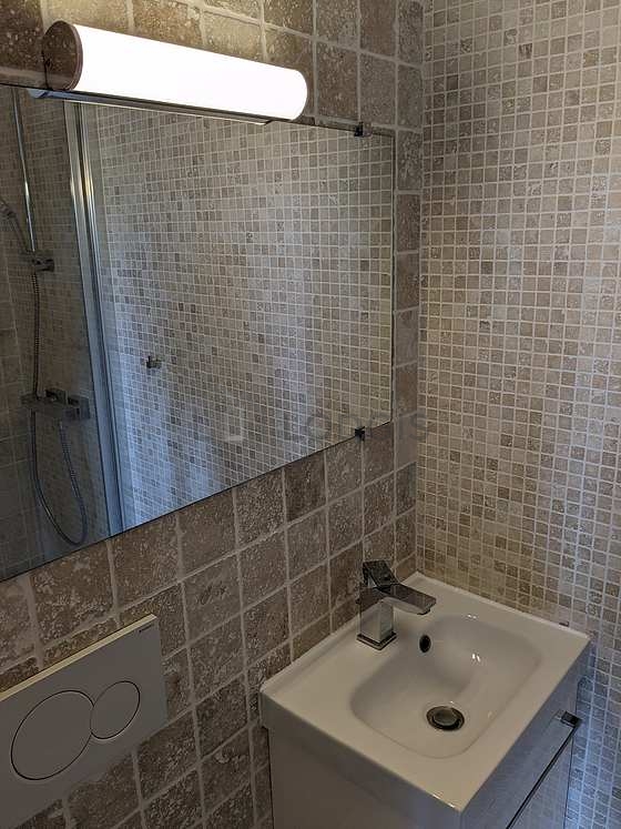 Bathroom equipped with shower in bath tub