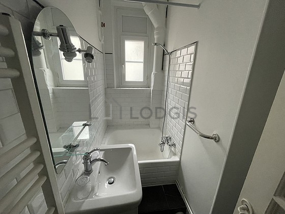 Bathroom equipped with separate shower, towel drying radiator
