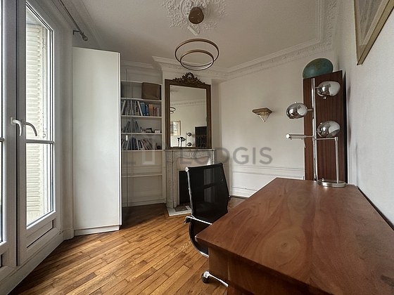 Beautiful office with wooden floor furnished with desk, bookcase, 1 chair(s)