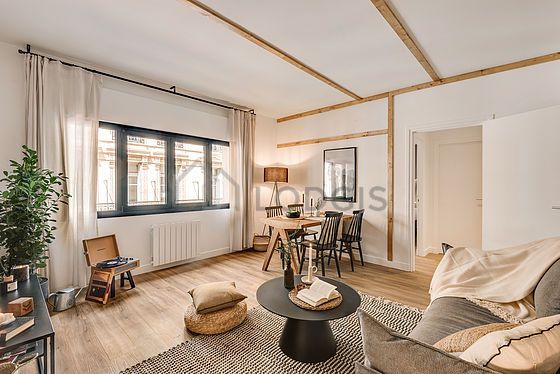 Living room furnished with tv, closet, cupboard