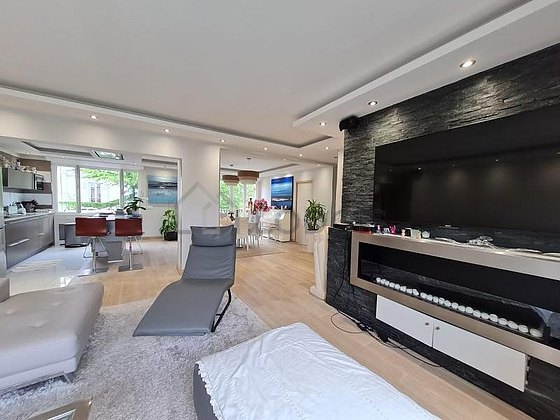 Living room furnished with tv, 1 armchair(s), 1 chair(s)