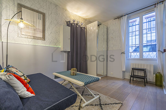 Living room with double-glazed windows facing the road