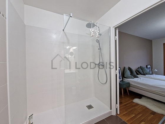 Bathroom equipped with washing machine, cupboard