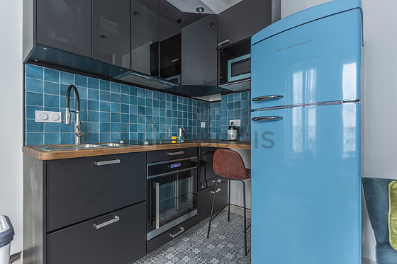 Kitchen equipped with dishwasher, hob, refrigerator, freezer