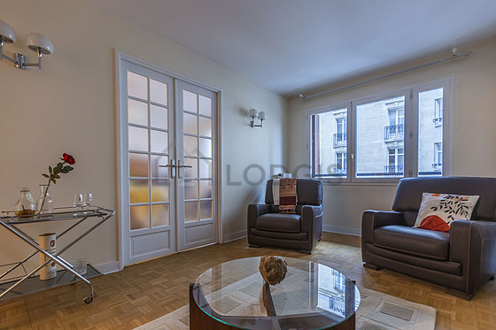 Very quiet living room furnished with tv, 1 armchair(s)