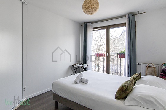 Bedroom with wooden floor