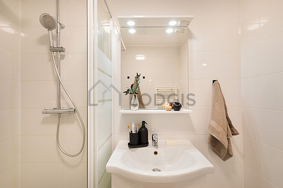 Bathroom equipped with separate shower, hair-dryer