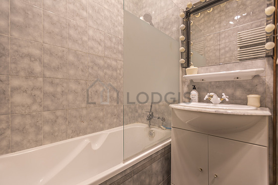 Pleasant and very bright bathroom with tile floor