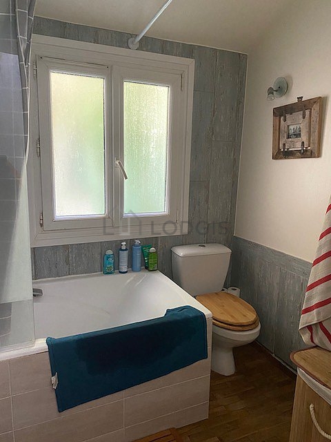 Pleasant bathroom with wooden floor