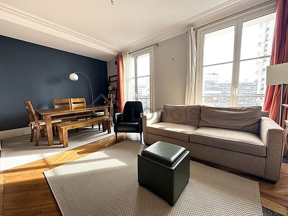 Living room with double-glazed windows facing the road