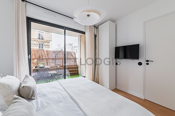 Bedroom with wooden floor