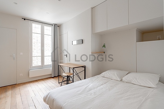 Bedroom equipped with desk, wardrobe, stool