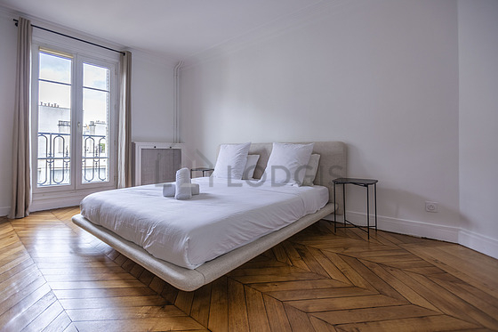 Bedroom equipped with bedside table