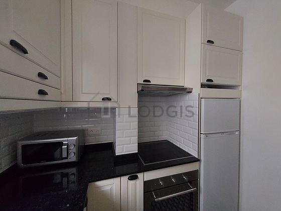 Kitchen equipped with washing machine, dryer, refrigerator, freezer