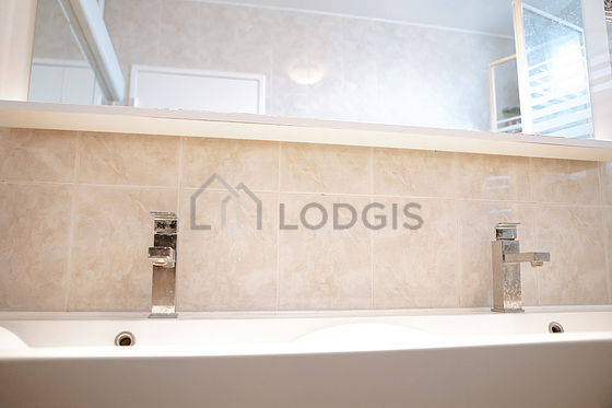 Pleasant and very bright bathroom with tile floor