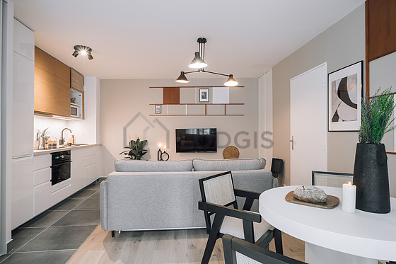 Kitchen equipped with dishwasher, hob, refrigerator, crockery