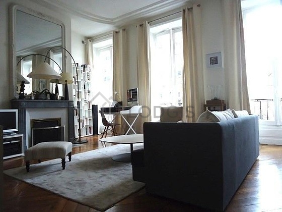 Living room furnished with tv, wardrobe