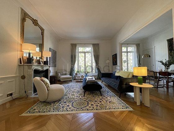 Living room furnished with sofa, coffee table, 1 chair(s)