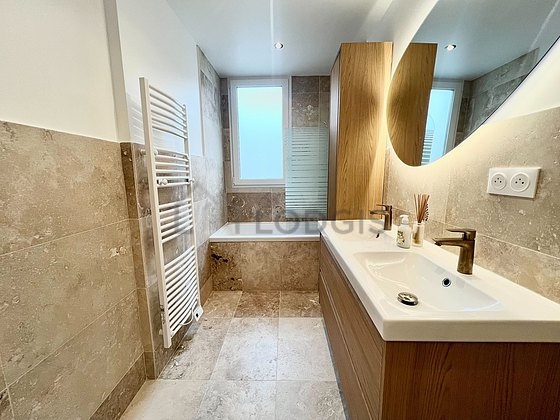 Bathroom equipped with washing machine, cupboard