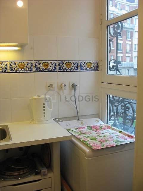 Bright kitchen with windows facing the road
