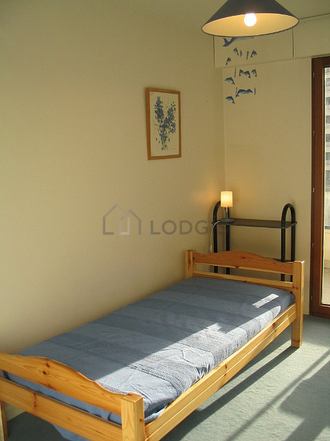 Bedroom with windows and balcony facing the garden
