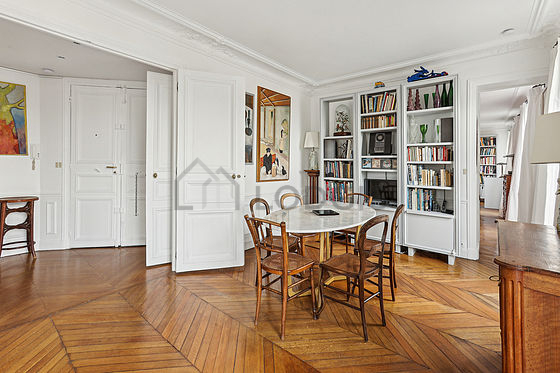 Dining room equipped with dining table, bookcase