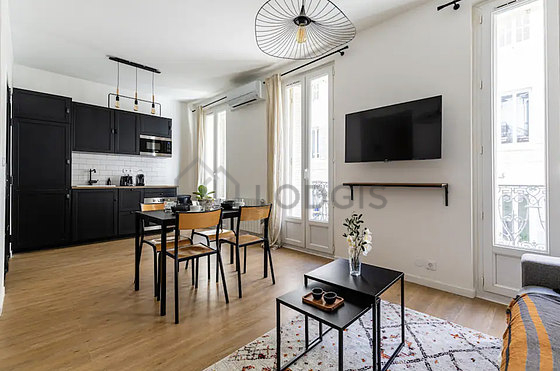 Living room furnished with air conditioning, tv, 1 chair(s)