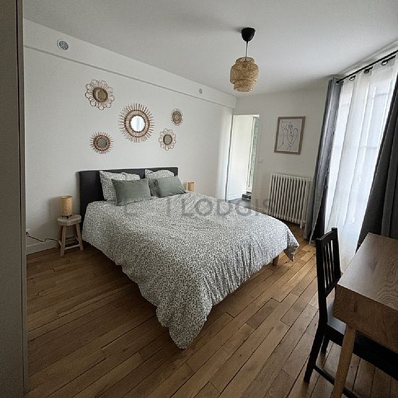 Bedroom with wooden floor