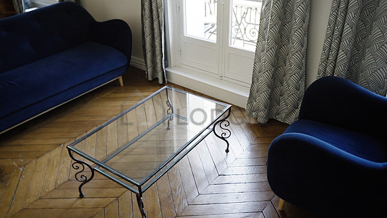 Very quiet living room furnished with tv, 1 armchair(s), 1 chair(s)