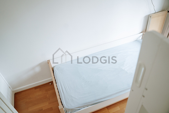 Bedroom with wooden floor