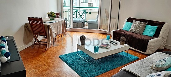 Quiet living room furnished with tv, 1 chair(s)