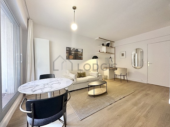 Living room with double-glazed windows and balcony