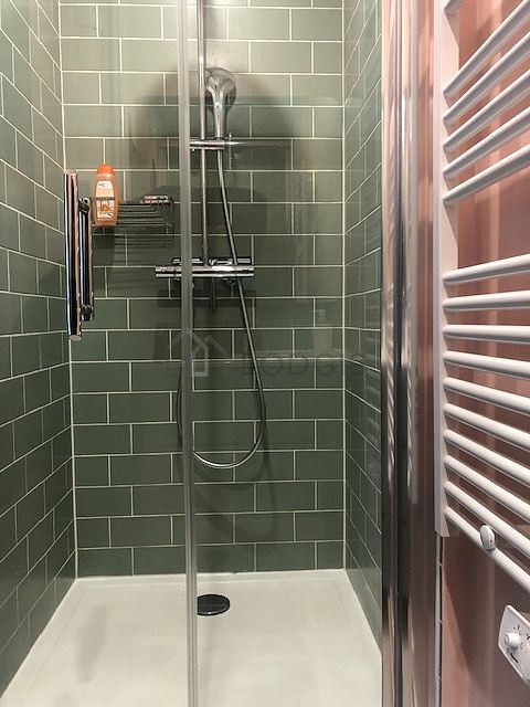 Bathroom equipped with separate shower, towel drying radiator