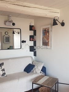 Salon de 14m² avec des tomettes au sol