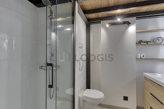 Bathroom equipped with washing machine, bath towels