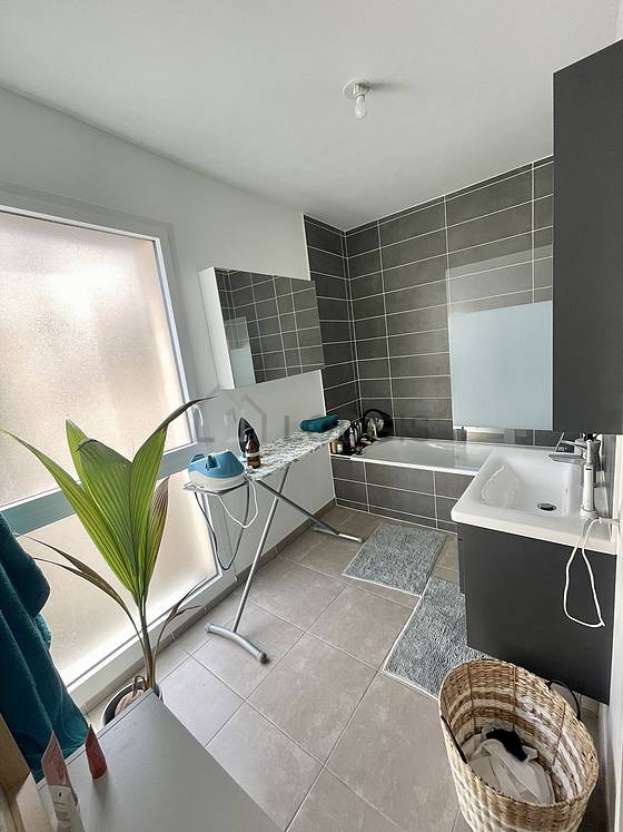 Pleasant and very bright bathroom with tile floor