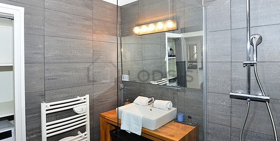 Bathroom equipped with washing machine, bath towels