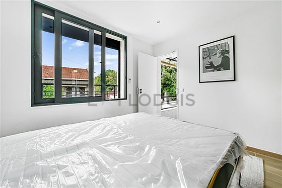 Bedroom with wooden floor