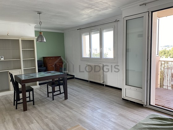 Living room with double-glazed windows and balcony